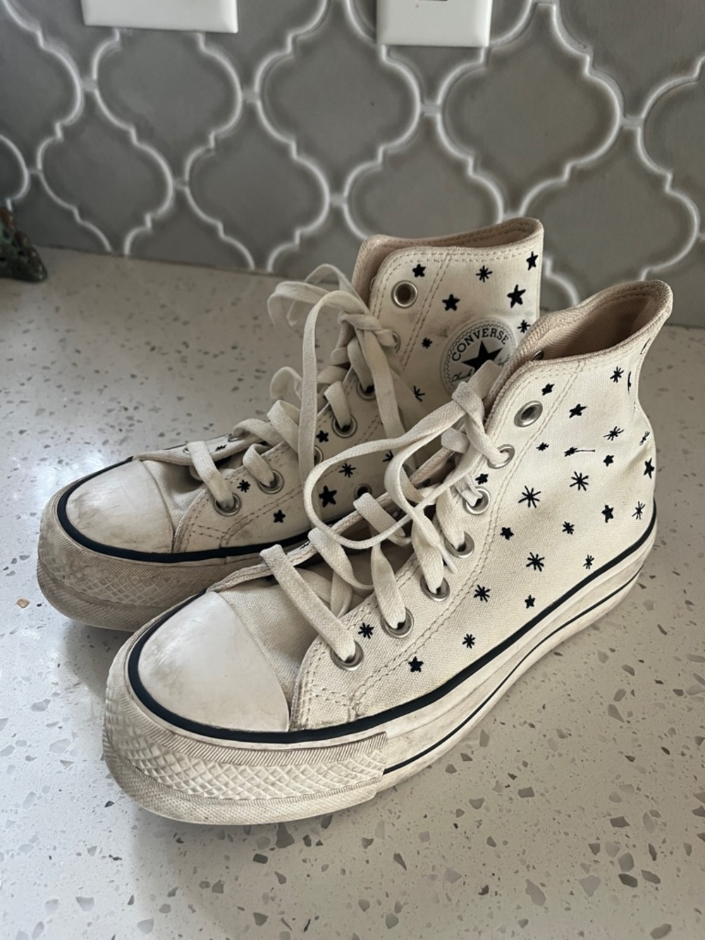 Converse Cream High Top Sneakers with Black Star Print